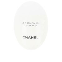 Tube  of  La  Crème  Main  Texture  Riche  by  Chanel,  a  rich  hand  cream  indicated  for  intense  hydration  and  skin  replenishment.