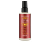 Bottle  of  Creme  Of  Nature  Argan  Oil  7-In-1  Treatment  by  Creme  Of  Nature,  a  leave-in  hair  care  indicated  for  frizz  control  and  shine.