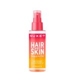 Spray of Nuxe Hair & Skin Happy In Pink by Nuxe, a fragrant mist indicated for hydrating and perfuming the body and hair.