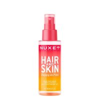 Spray  of  Nuxe  Hair  &  Skin  Happy  In  Pink  by  Nuxe,  a  fragrant  mist  indicated  for  hydrating  and  perfuming  the  body  and  hair.