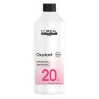 Bottle  of  LOréal  Professionnel  Oxydant  Cream  Developer  by  LOréal,  a  cream  indicated  for  hair  color  fixation  and  shine.
