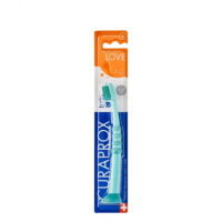 Product  container  of  Curaprox  Baby  Toothbrush  0-4  Years  by  Curaprox,  a  toothbrush  indicated  for  cleaning  baby  teeth  and  gums.