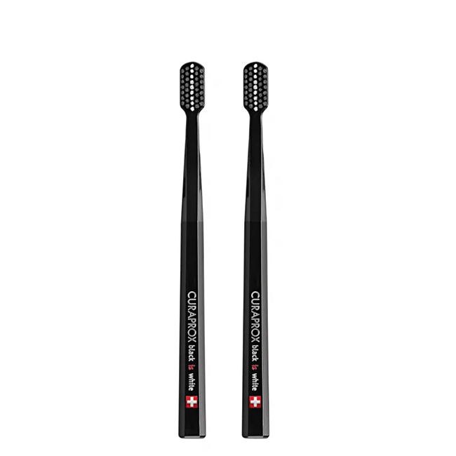 CuraproxBlackisWhiteBlackToothbrushesSetx2 Box of Curaprox Black is White Black Toothbrushs 2un by Curaprox, a soft toothbrush indicated for tooth sensitivity.