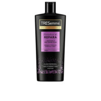 Bottle  of  Tresemmé  Biotin  Repair  Shampoo  by  Tresemmé,  a  cream  shampoo  indicated  for  repairing  damaged  hair.