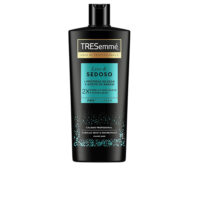 Bottle  of  Tresemmé  Smooth  &  Silky  Shampoo  by  Tresemmé,  a  cream  shampoo  indicated  for  dry  and  frizz-prone  hair.