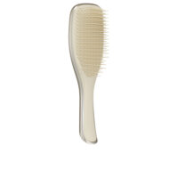 Product  container  of  Tangle  Teezer  Wet  Detangler  Brush  Chrome  Gold  Pink  by  Tangle  Teezer,  a  hairbrush  indicated  for  removing  knots.