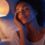 Woman applying night cream before bed in evening skincare routine