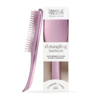 Product  container  of  Tangle  Teezer  Wet  Detangler  Brush  Chrome  Mauve  by  Tangle  Teezer,  a  hairbrush  indicated  for  removing  hair  knots.